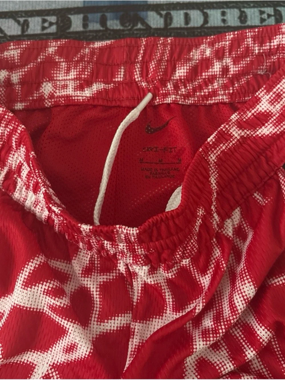 Nike red with white design fly shorts